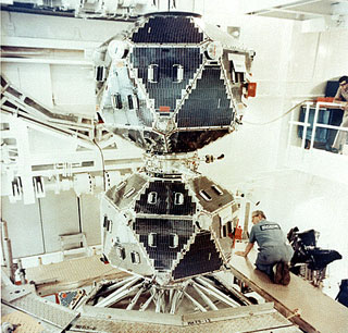 A pair of Vela satellites in the clean room prior to launch: The Vela satellites are stacked one on top of the other in a clean room prior to the launch.  The two polyhedron-shaped satellites (with 20 sides) would detach from each other after launch.