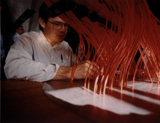 SDSS Plates: Rich Kron placing fiber optic cables in each of the 640 holes drilled into the plate for observing.  The entire process could take up to one hour.