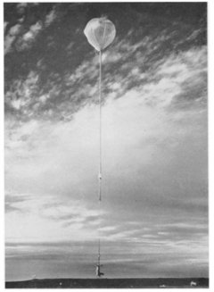 Stratoscope II After Launch: At launch, the heavy-lift launch balloon is inflated above the uninflated main balloon.  The observatory is 660 feet tall at launch. For more information about Stratoscope II, see Danielson, R. E., AmSci, 51, 375.