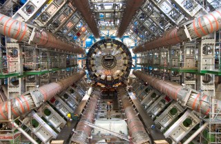 Large Hadron Collider: Installing the ATLAS calorimeter at the Large Hadron Collider. Compare the size of the experiment to the individuals working on the calorimeter.