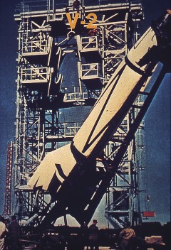 V-2 Rocket:  A V-2 rocket is hoisted into a static test facility at White Sands, New Mexico. The German engineers and scientists who developed the V-2 came to the United States at the end of World War II and continued rocket testing under the direction of the U. S. Army, launching more than sixty V-2s.