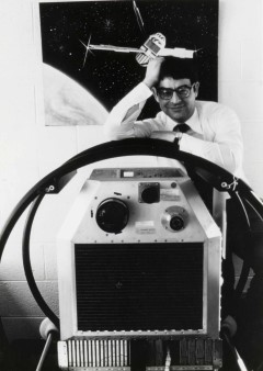 Image Title: Riccardo Giacconi stands with the Uhuru satellite, circa 1970.