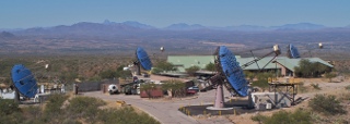 The VERITAS Array: VERITAS (Very Energetic Radiation Imaging Telescope Array System) is a system of four ground-based telescopes focused on gamma-ray science. Since gamma rays cannot penetrate the atmosphere, the telescopes observe the Cherenkov light emitted by showers of particles produced when the gamma rays interact in the Earth’s atmosphere. They can then image the trajectories of the secondary particles passing through the atmosphere, and use this information to infer the arrival direction and energy of the original gamma ray.