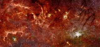 Hubble-Spitzer Color Mosaic of the Galactic Center: This composite color infrared image of the center of our Milky Way Galaxy reveals a new population of massive stars and new details in complex structures in the hot ionised gas swirling around the central 300 light-years. This sweeping panorama is the sharpest infrared picture ever made of the Galactic core. It offers a nearby laboratory for how massive stars form and influence their environment in the often violent nuclear regions of other galaxies.