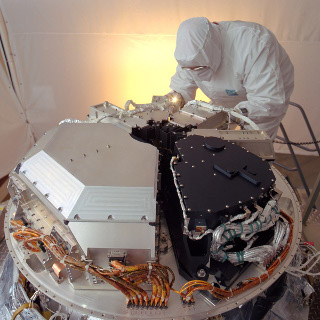 Infrared Array Camera: The Infrared Array Camera (IRAC) on the Spitzer Space Telescope. It contains four detector arrays with 256 x 256 pixels each. Here it is being installed in a clean room.
