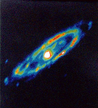 Andromeda: This image of the Andromeda galaxy is made up of observations by the Infrared Astronomical Satellite (IRAS). The white and yellow areas represent areas where young stars are likely forming.