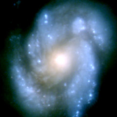 M100 Galactic Nucleus: This image was taken before the optics was fixed and demonstrates that the optical error generates images that are not much better than images taken with ground-based telescopes and were much less clear than expected. The picture is from the Wide Field Planetary Camera 1.