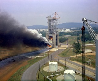 Apollo Program Saturn V F-1 Engine Testing: This photograph depicts a test firing of an F-1 engine in the west test area of the Marshall Space Flight Center. This engine produced 1,500,000 pounds of thrust using liquid oxygen and RP-1, which is a derivative of kerosene. The F-1 engine was used to launch the Saturn V launch vehicle to the Moon during the Apollo program.